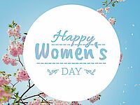 Schriftzug: Happy Women's Day mit blühender Zierkirsche im Hintergrund